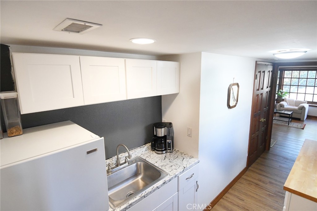 5621 Alwick Place Brea, CA 92821 - Photo 23 of 43 a kitchen with a refrigerator and a stove top oven