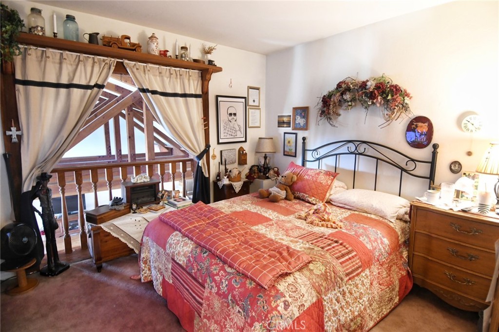 5621 Alwick Place Brea, CA 92821 - Photo 28 of 43 a bedroom with bed and a chandelier