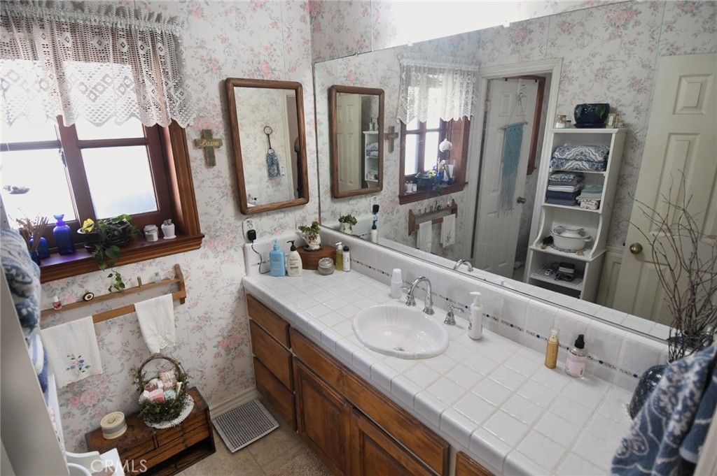 5621 Alwick Place Brea, CA 92821 - Photo 32 of 43 a bathroom with a sink double vanity and a mirror
