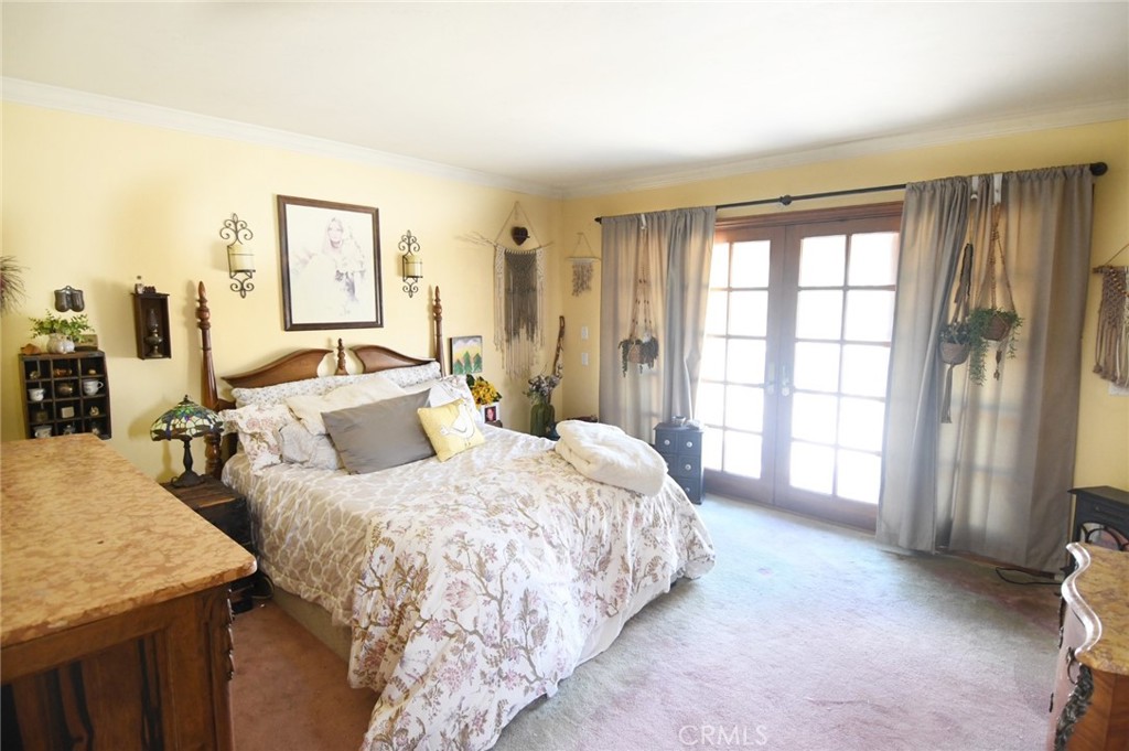 5621 Alwick Place Brea, CA 92821 - Photo 34 of 43 a spacious bedroom with a bed and a large window