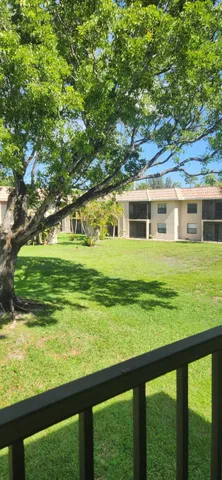 a view of a house with a big yard