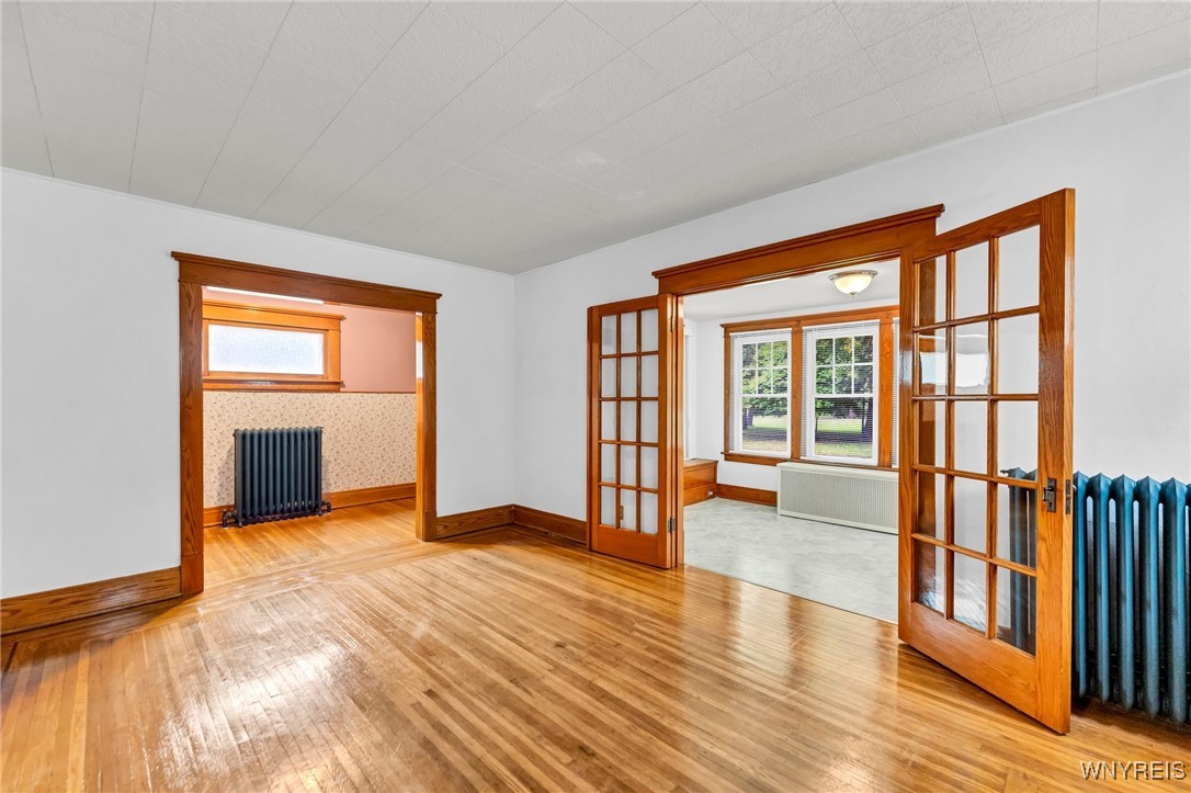 103 Potters Road Buffalo, NY 14220 - Photo 14 of 49 french doors lead to sunroom