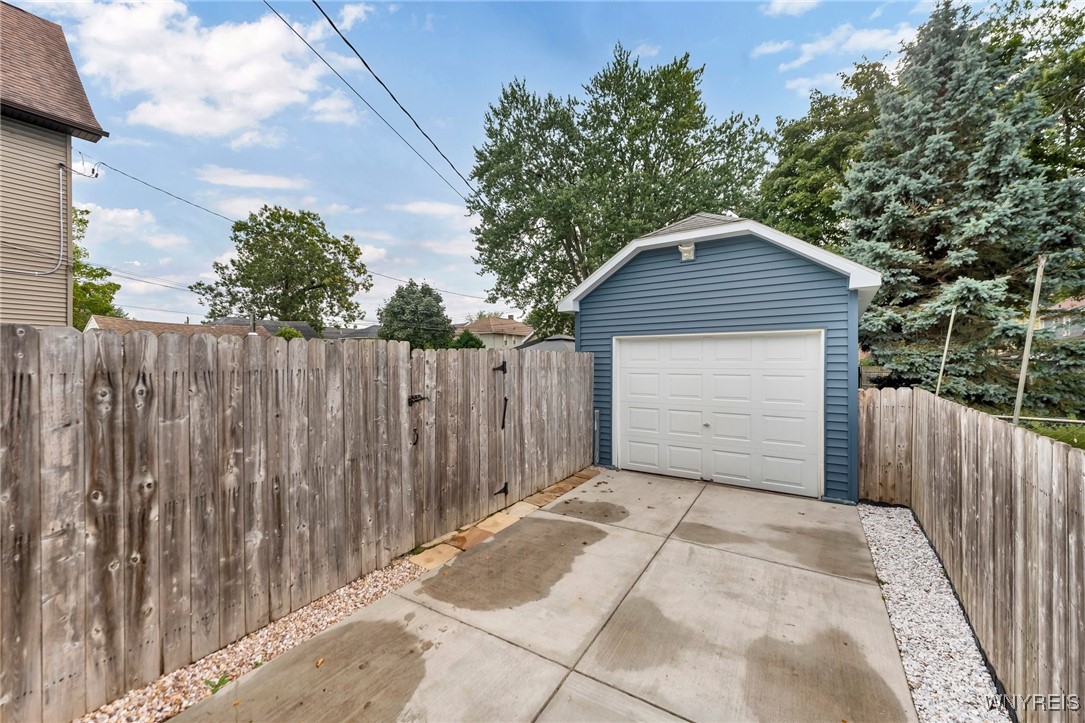 103 Potters Road Buffalo, NY 14220 - Photo 48 of 49 Newer concrete driveway leads to garage