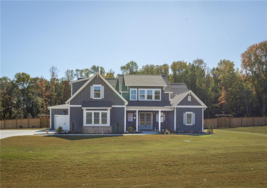 255 Old Town Road Dacula, GA 30019 - Photo 6 of 38 a front view of a house with garden