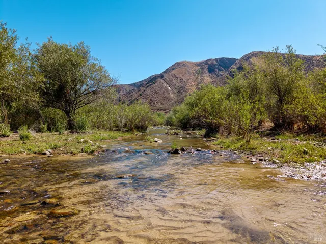 a view of a city with mountains in the background