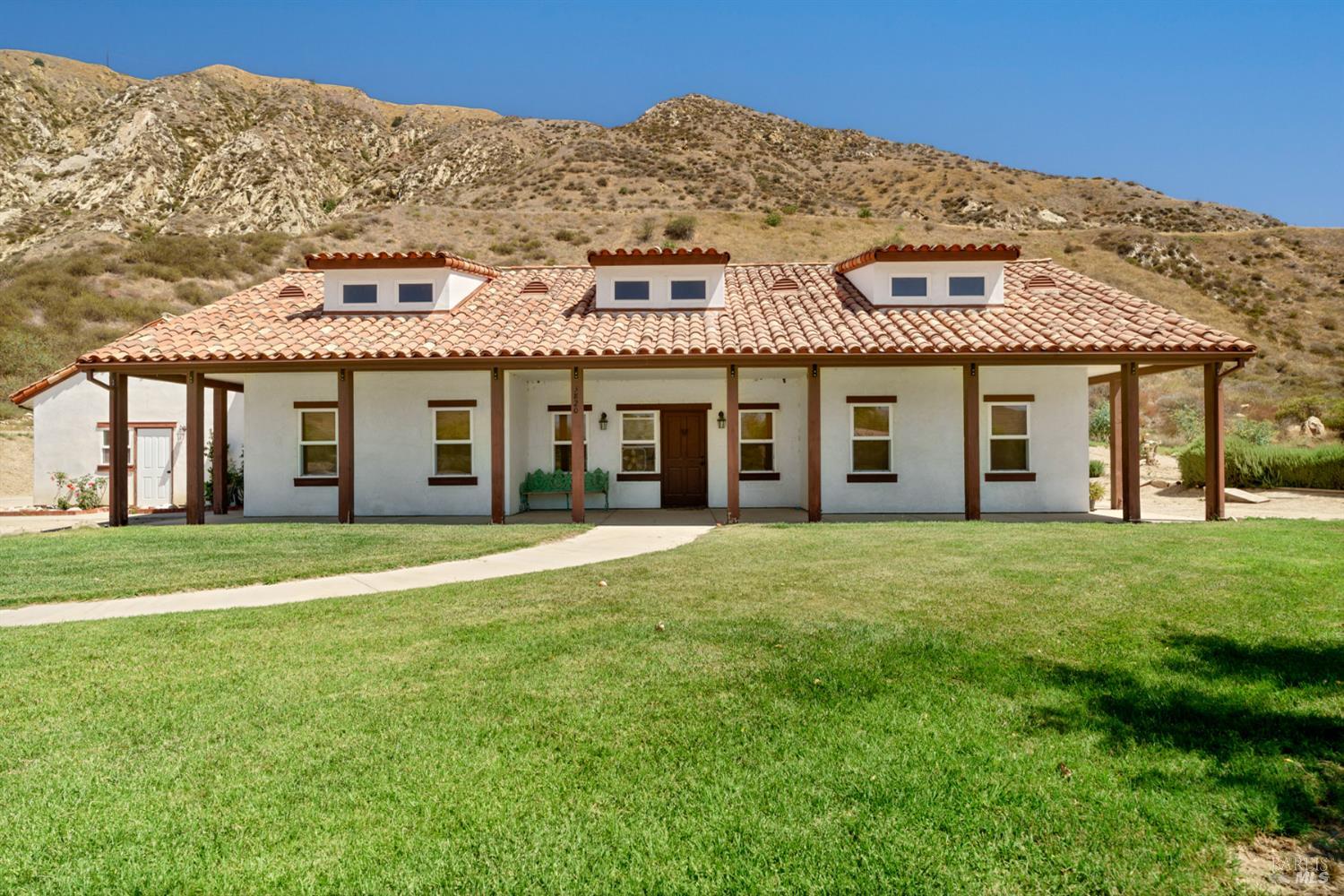 3800 Piru Canyon Road Piru, CA 93040 - Photo 51 of 65 a front view of a house with a garden