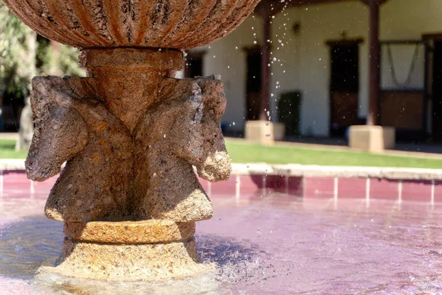 a living room with furniture and large windows
