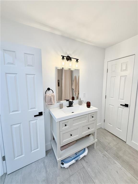 3188 Delmar Lane Northwest Atlanta, GA 30311 - Photo 16 of 16 a room with a bed and a mirror