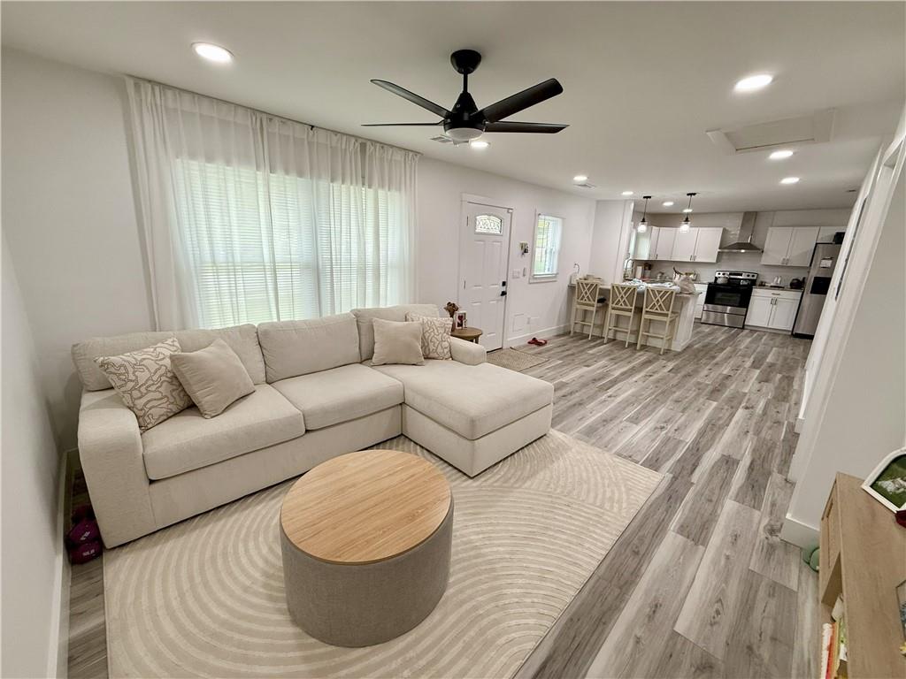3188 Delmar Lane Northwest Atlanta, GA 30311 - Photo 2 of 16 a living room with furniture and a large window