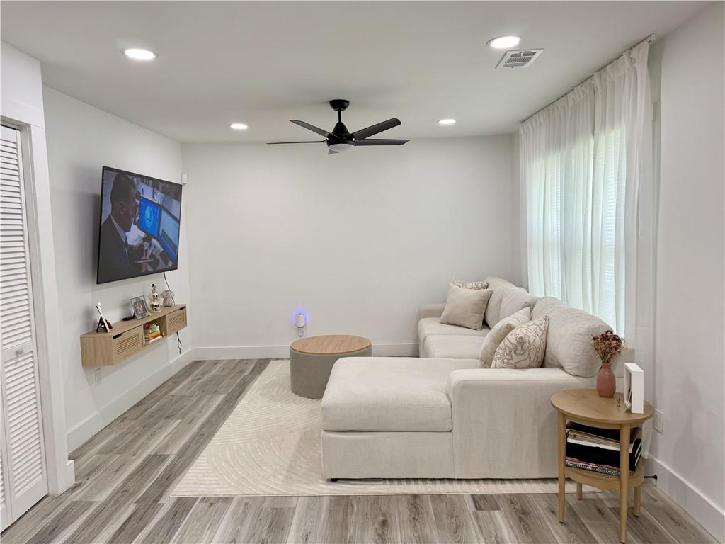 3188 Delmar Lane Northwest Atlanta, GA 30311 - Photo 4 of 16 a living room with furniture and a flat screen tv