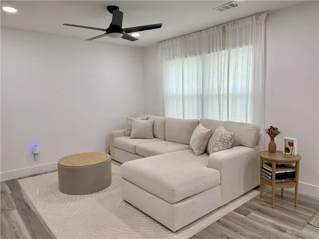 a living room with a couch and a table