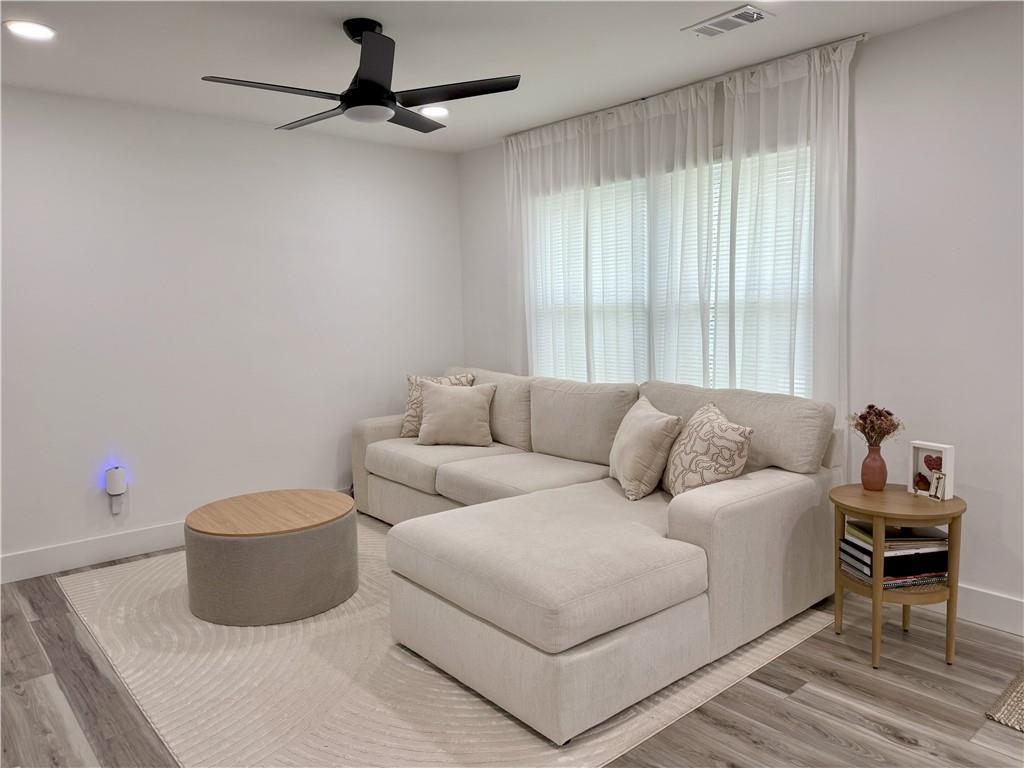 3188 Delmar Lane Northwest Atlanta, GA 30311 - Photo 5 of 16 a living room with a couch and a table