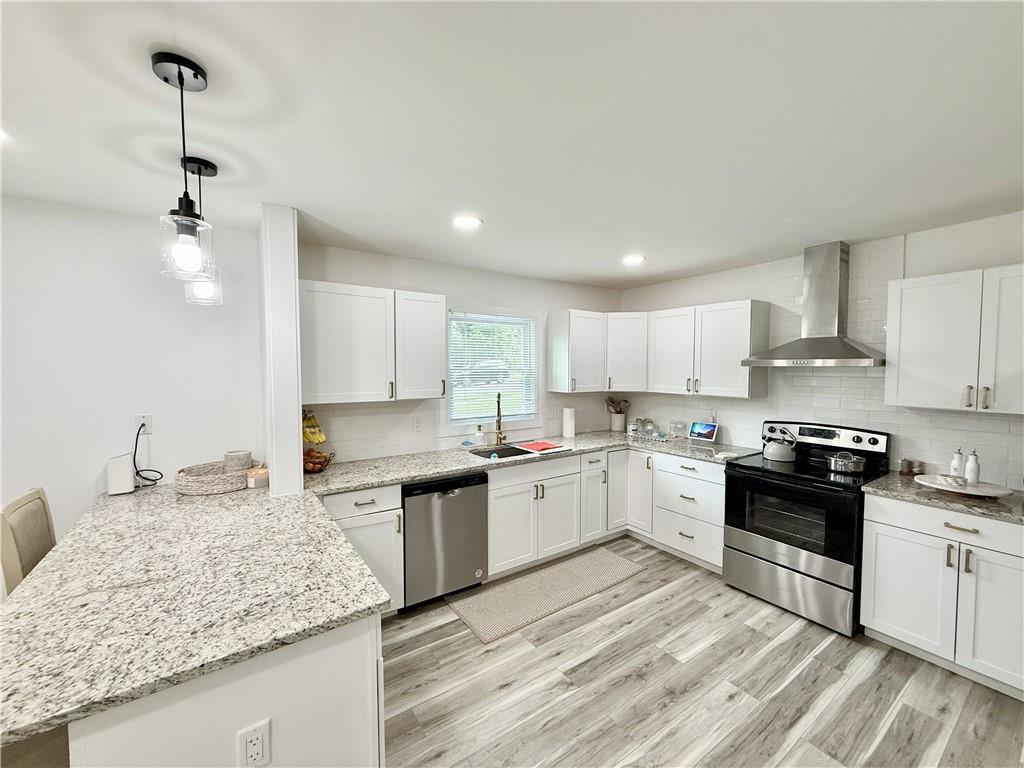 3188 Delmar Lane Northwest Atlanta, GA 30311 - Photo 7 of 16 a kitchen with stainless steel appliances granite countertop a sink stove and refrigerator