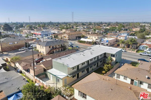 an aerial view of a multi story parking building