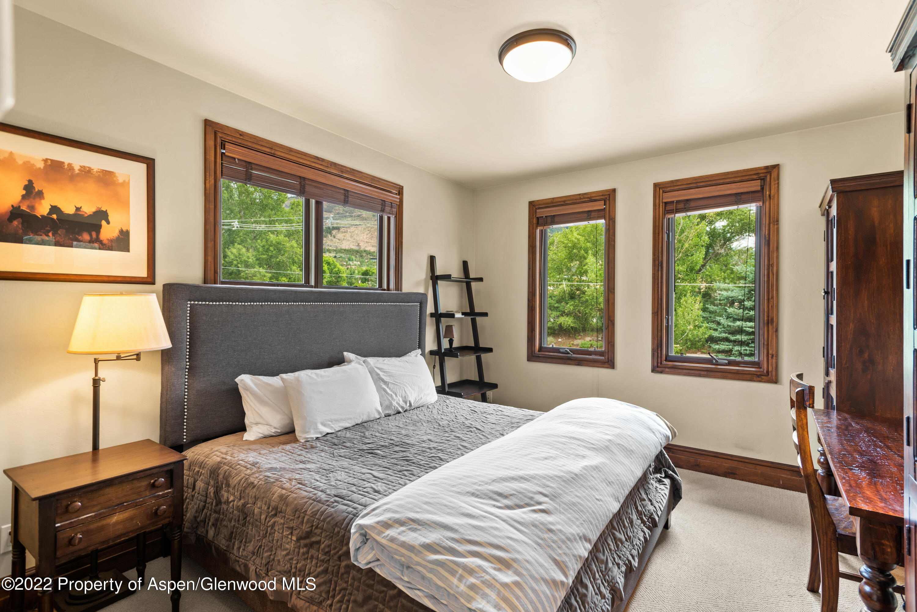 23272 2 Rivers Road, Unit 201 Basalt, CO 81621 - Photo 18 of 25 a bedroom with a bed and a large window