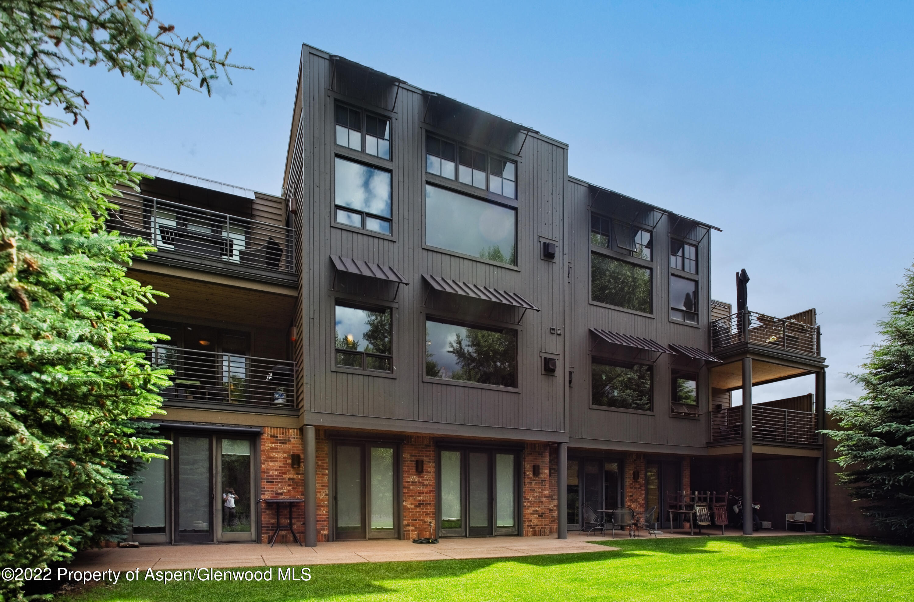 23272 2 Rivers Road, Unit 201 Basalt, CO 81621 - Photo 2 of 25 a front view of building with yard