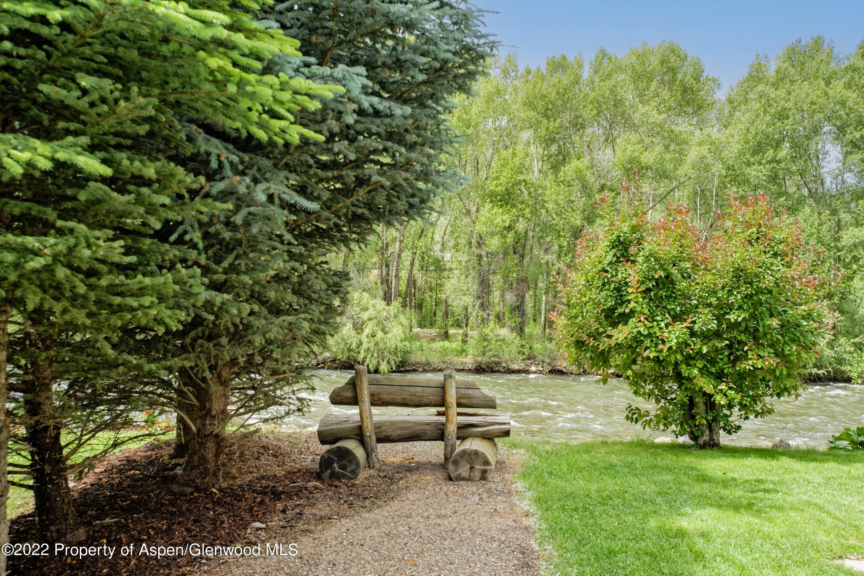 23272 2 Rivers Road, Unit 201 Basalt, CO 81621 - Photo 3 of 25 a view of a bench in a garden