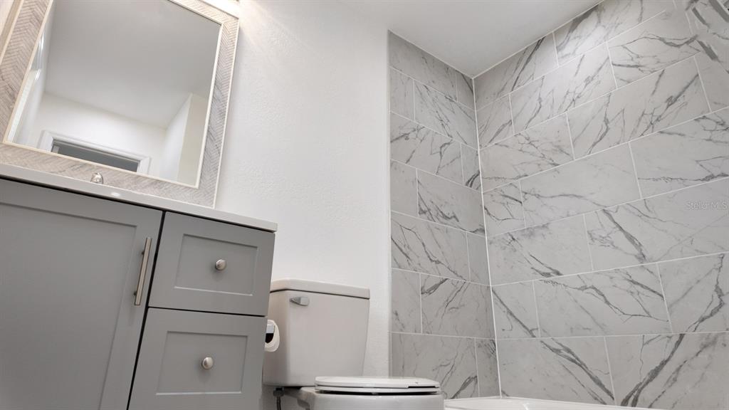 2607 Northeast 140th Street Citra, FL 32113 - Photo 19 of 36 a bathroom with a shower