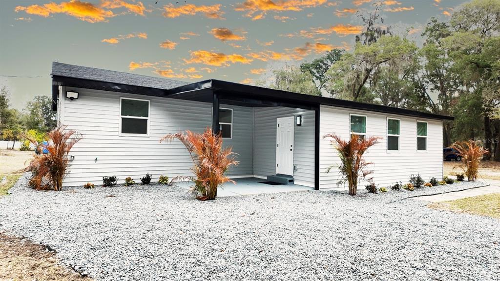 2607 Northeast 140th Street Citra, FL 32113 - Photo 3 of 36 a view of a house with backyard