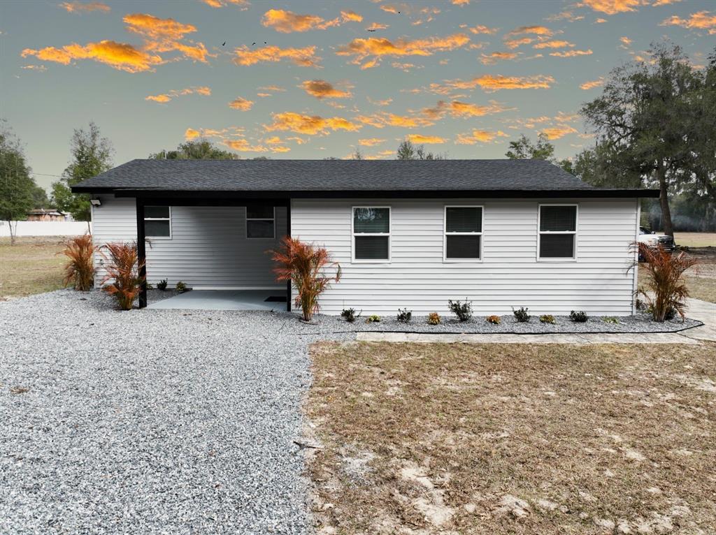 2607 Northeast 140th Street Citra, FL 32113 - Photo 32 of 36 a house view with a backyard space