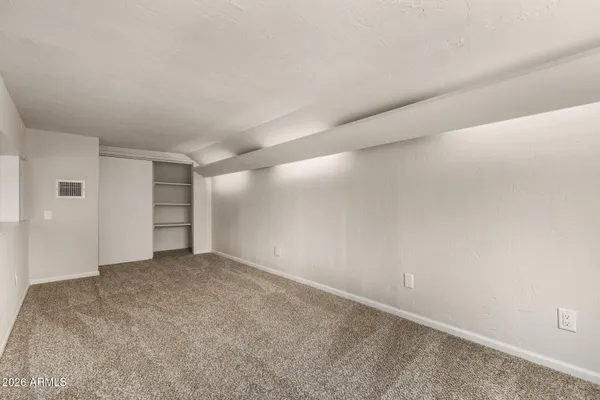 a view of an empty room and closet