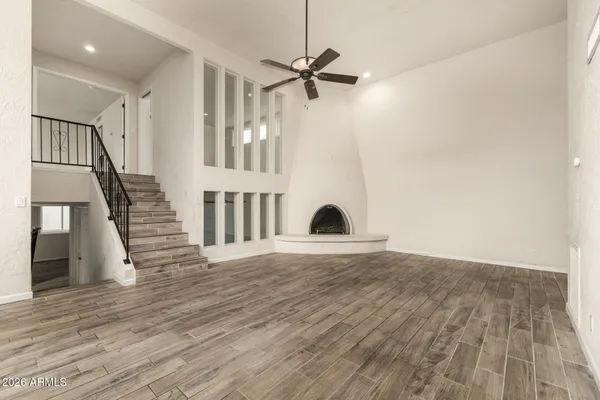a view of an entryway with wooden floor