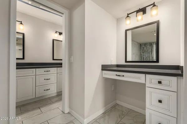a bathroom with sink and mirror