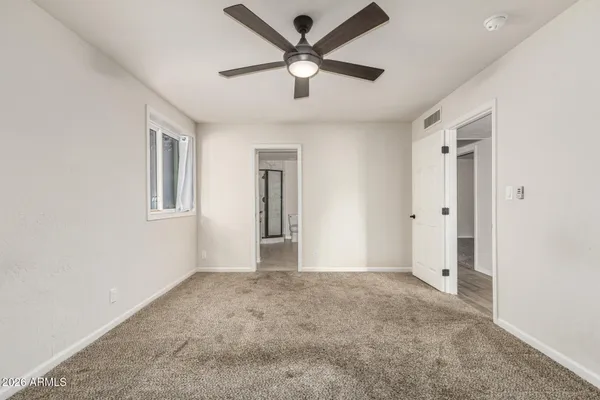 a view of an empty room with a window