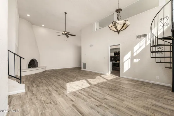 a view of an entryway with wooden floor