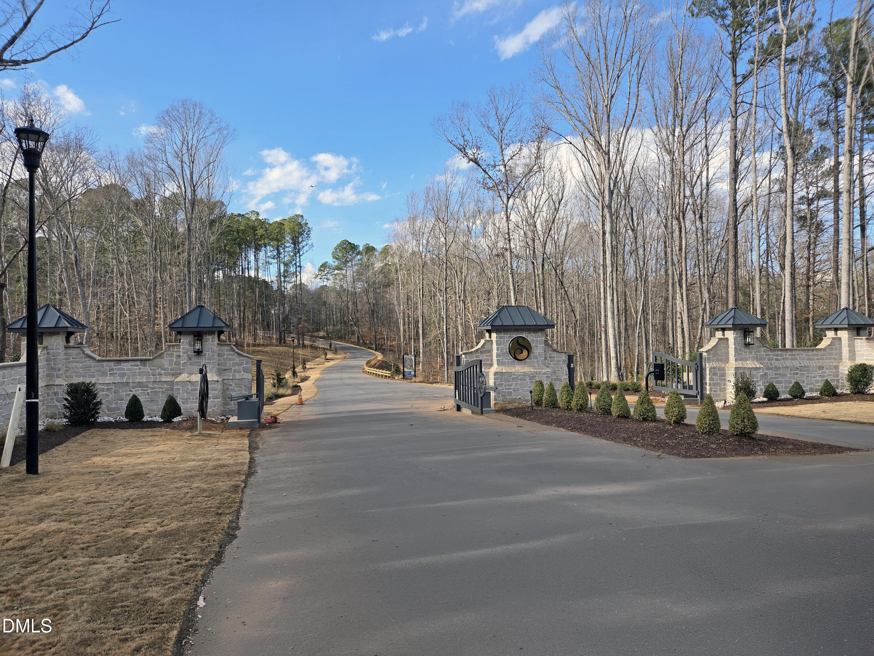 6460 Sanctuary Falls Drive Raleigh, NC 27614 - Photo 18 of 21 a view of a street with cars