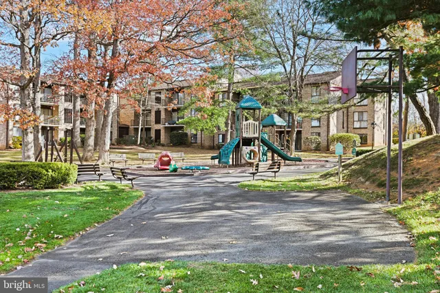 a view of a park with swings and slides