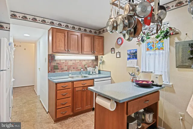 a kitchen with a stove and a refrigerator