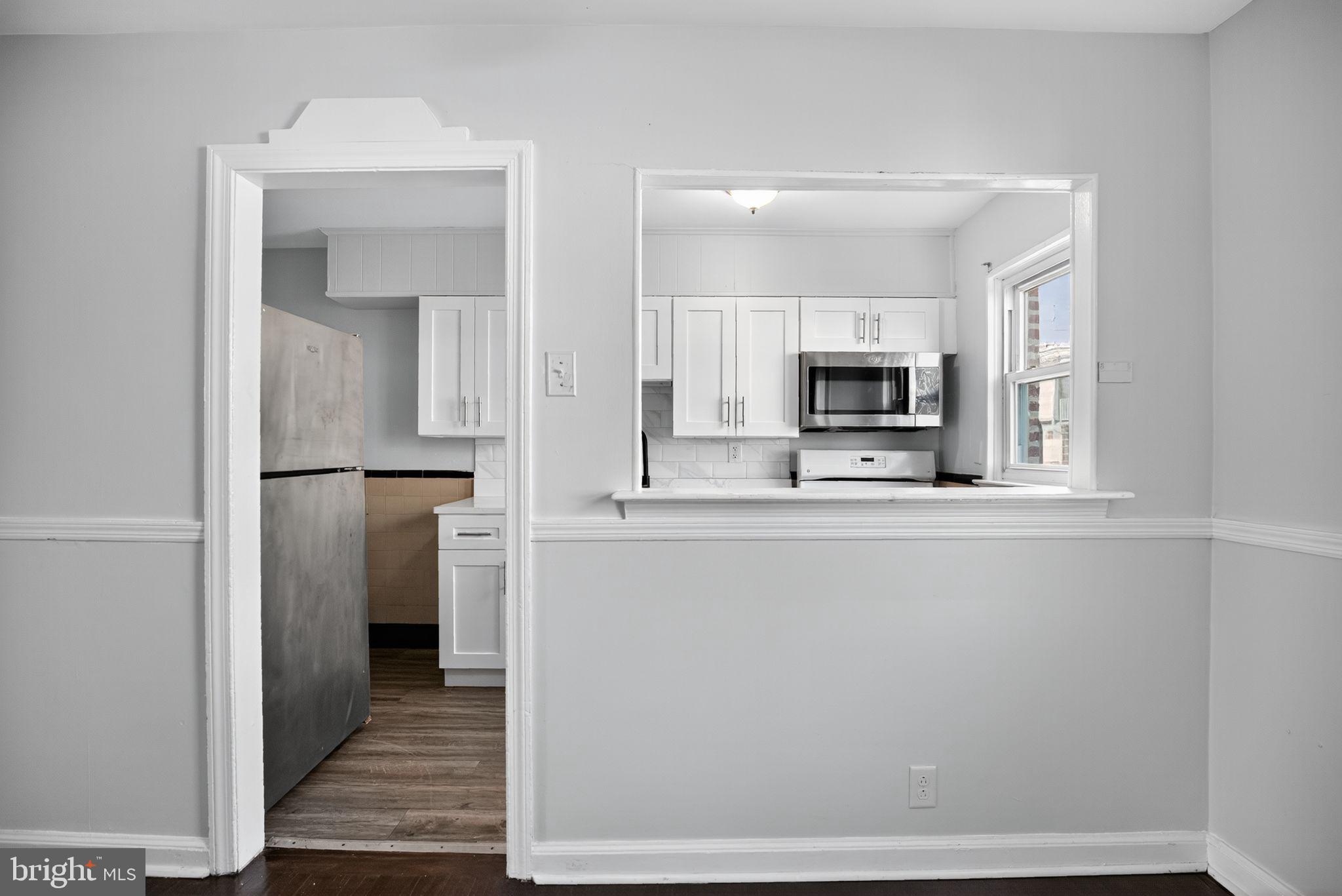 558 Snowden Road Upper Darby, PA 19082 - Photo 11 of 30 a view of a kitchen from the hallway