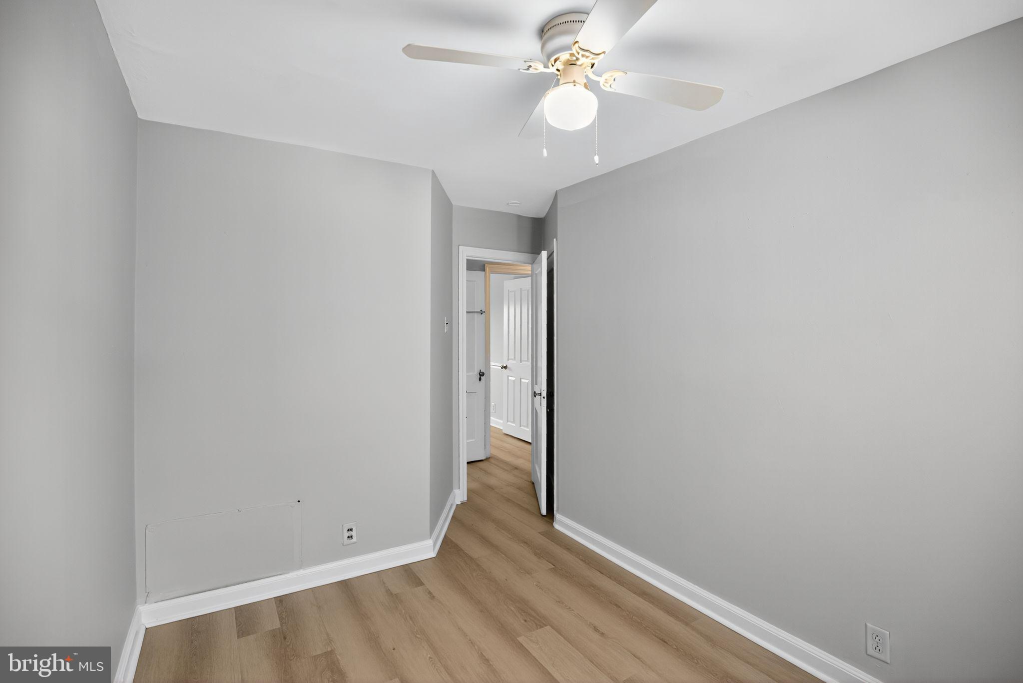558 Snowden Road Upper Darby, PA 19082 - Photo 18 of 30 an empty room with a window and a ceiling fan