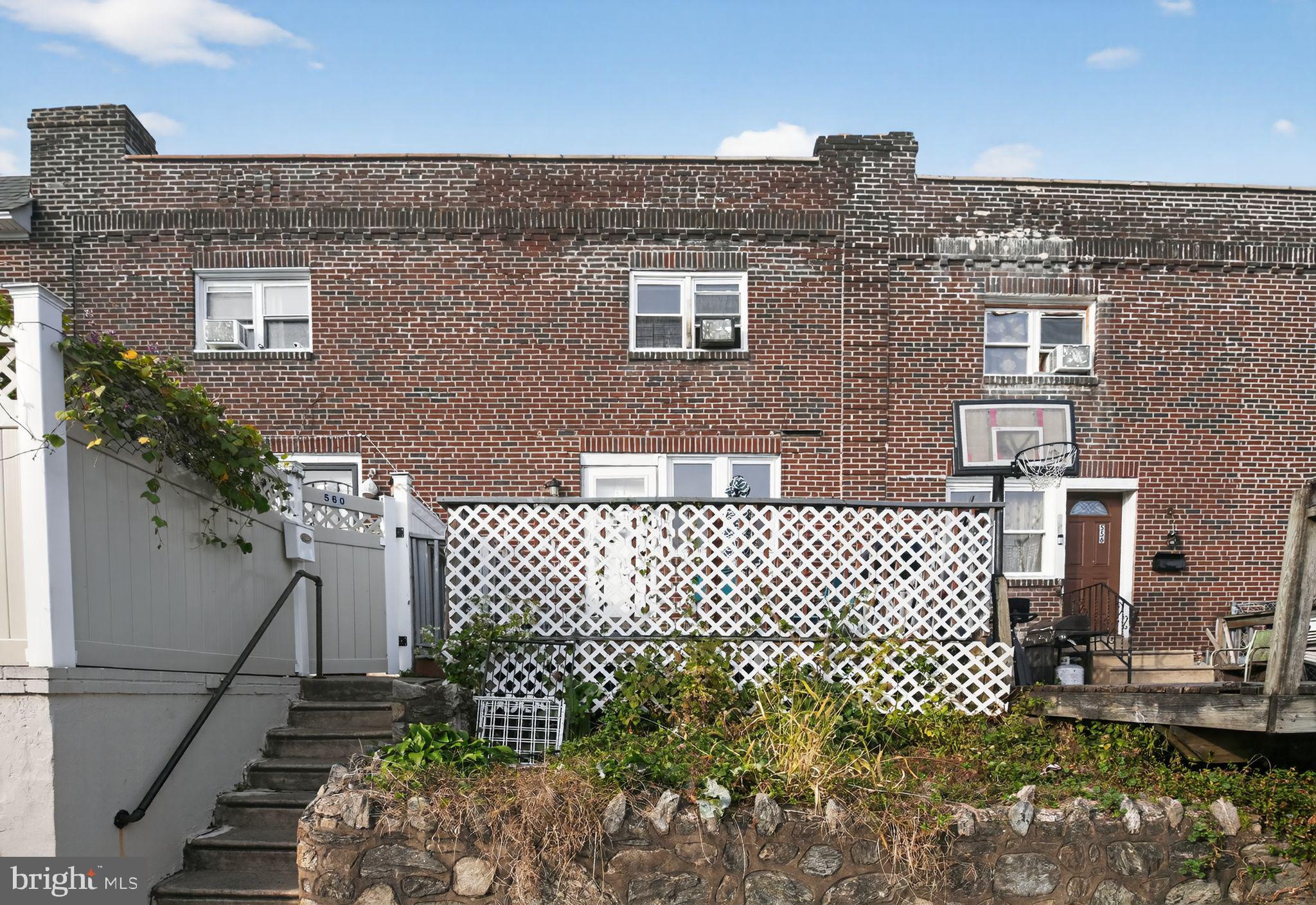 558 Snowden Road Upper Darby, PA 19082 - Photo 2 of 30 a front view of a house with a garden