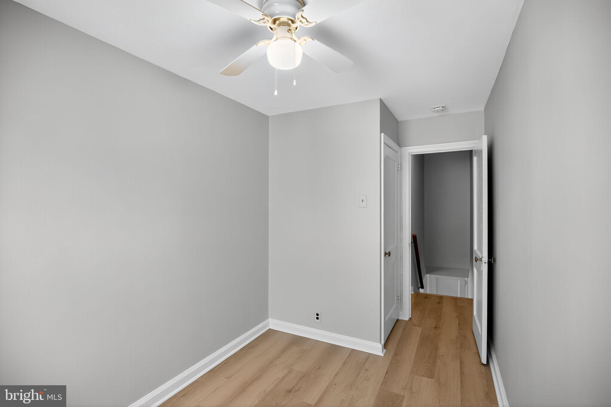 558 Snowden Road Upper Darby, PA 19082 - Photo 23 of 30 a view of a room with wooden floor and fan