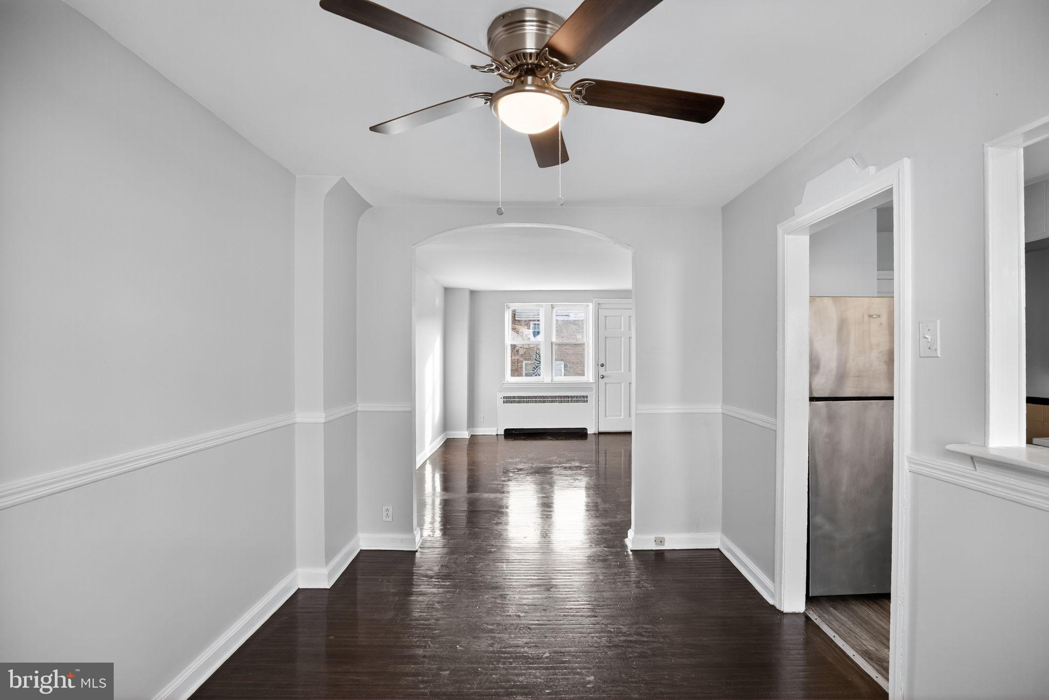 558 Snowden Road Upper Darby, PA 19082 - Photo 25 of 30 a view of livingroom with hardwood floor and a ceiling fan