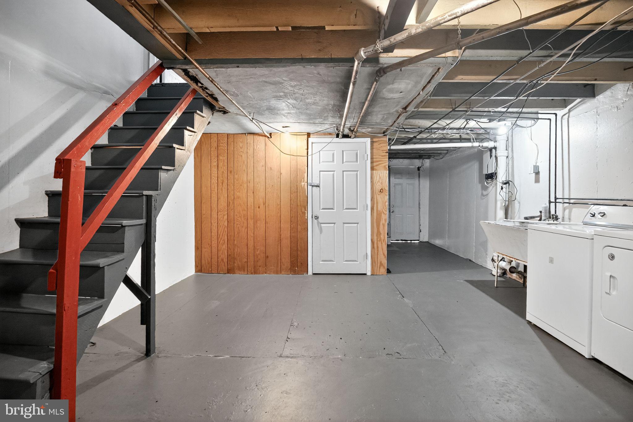 558 Snowden Road Upper Darby, PA 19082 - Photo 28 of 30 a view of hallway with stairs and a chandelier