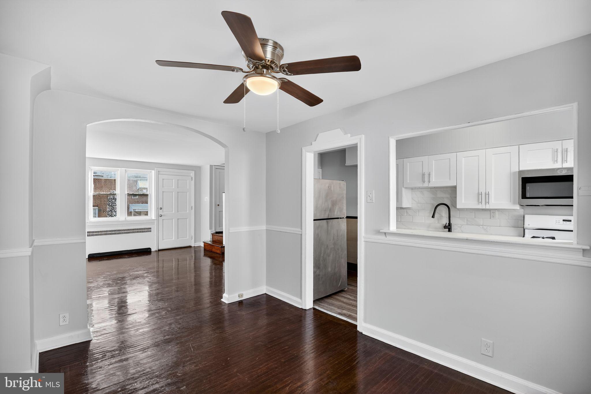 558 Snowden Road Upper Darby, PA 19082 - Photo 7 of 30 a view of kitchen with sink and wooden floor