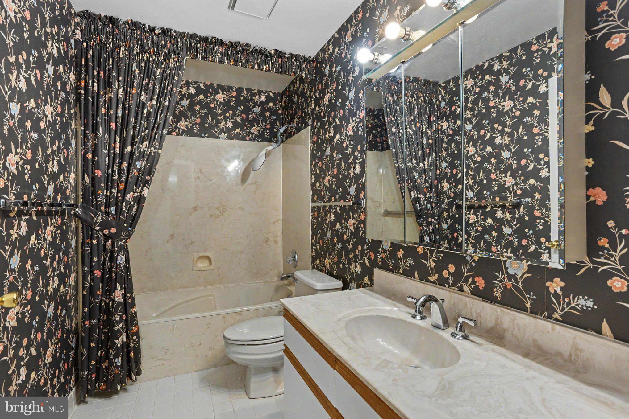 3021 Fallstaff Road, Unit 208B Baltimore, MD 21209 - Photo 24 of 25 a bathroom with a sink toilet and shower