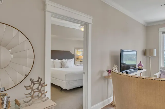 a bedroom with a bed and mirror