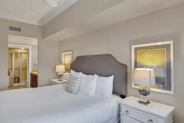 a bed room with a bed and a night stand