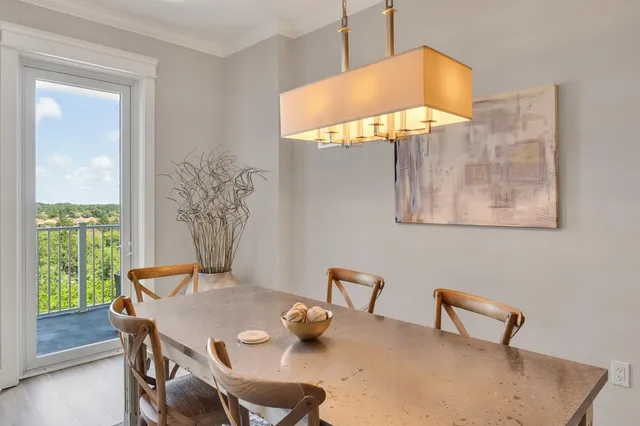 a view of a dining room with furniture and a window