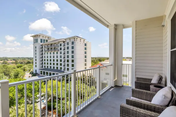 a view of balcony with furniture