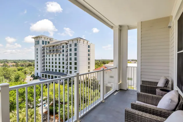 a view of balcony with furniture