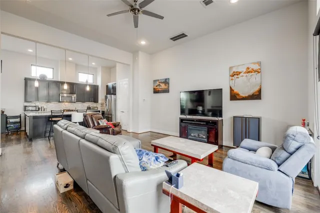 a kitchen with granite countertop a sink a stove and cabinets