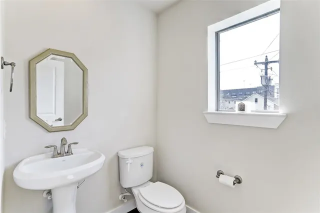 a view of a balcony with chair and a floor to ceiling window