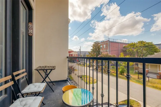 a view of balcony with furniture