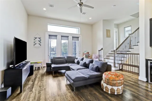 a kitchen with a dining table chairs and refrigerator