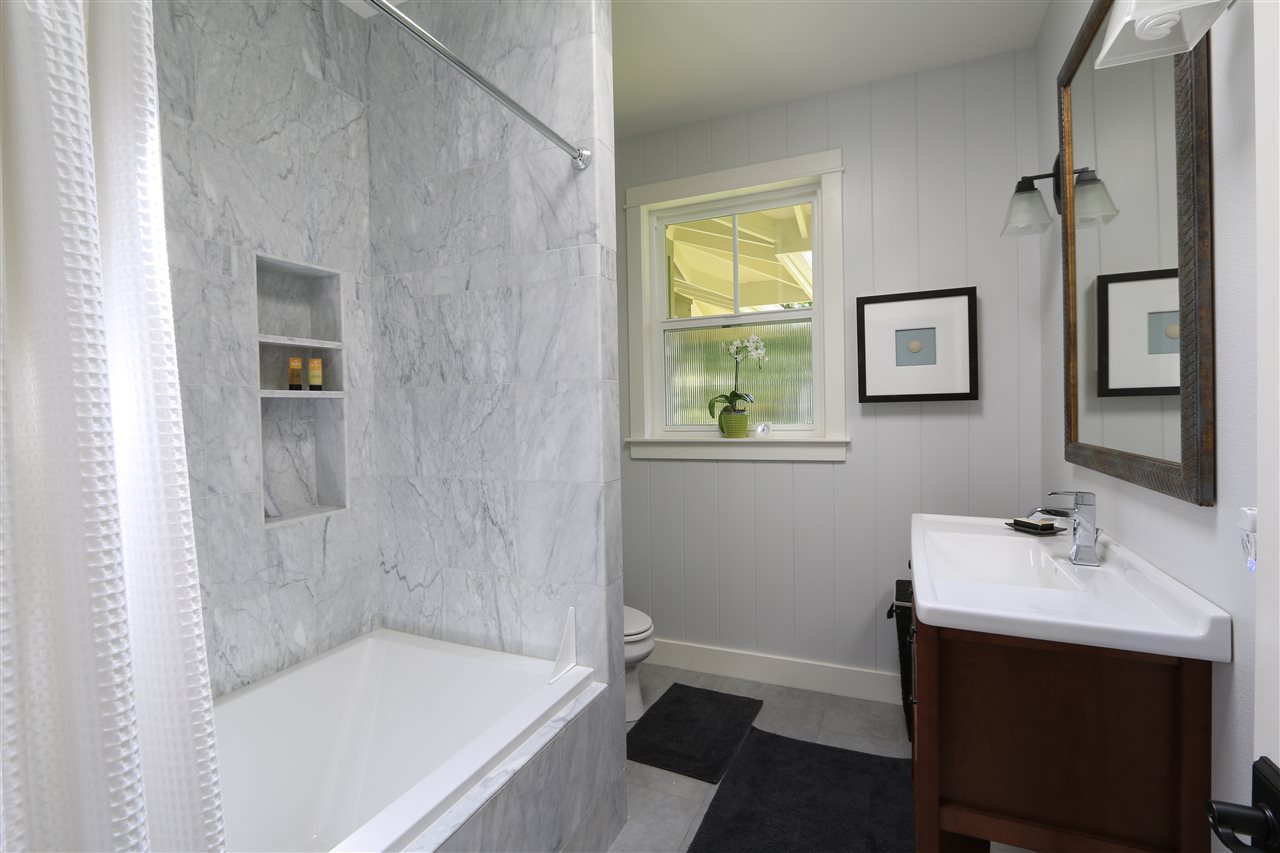 2736 Kaupakalua Road Haiku, HI 96708 - Photo 15 of 30 a bathroom with a sink and a bathtub